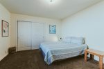 2nd bedroom upstairs features queen sized bed